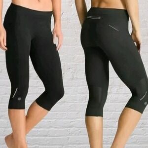 Athleta Black Cropped Running Leggings Women Small Pockets Reflective Capri Yoga